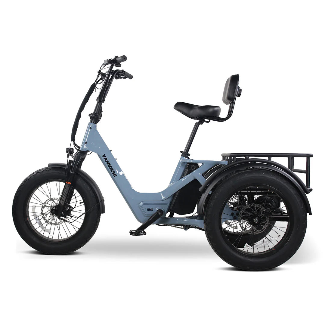 Vamoose Tri-Cycle SST electric trike with 52V 750W rear hub motor and rear differential for stability. Features 20"x4" fat tires, hydraulic disc brakes, comfortable plush seat, folding handlebar stem, and a large 52V 20Ah Samsung battery for extended range. Includes rear carrier bag, front shovel rack, and LED lights with signal indicator.
