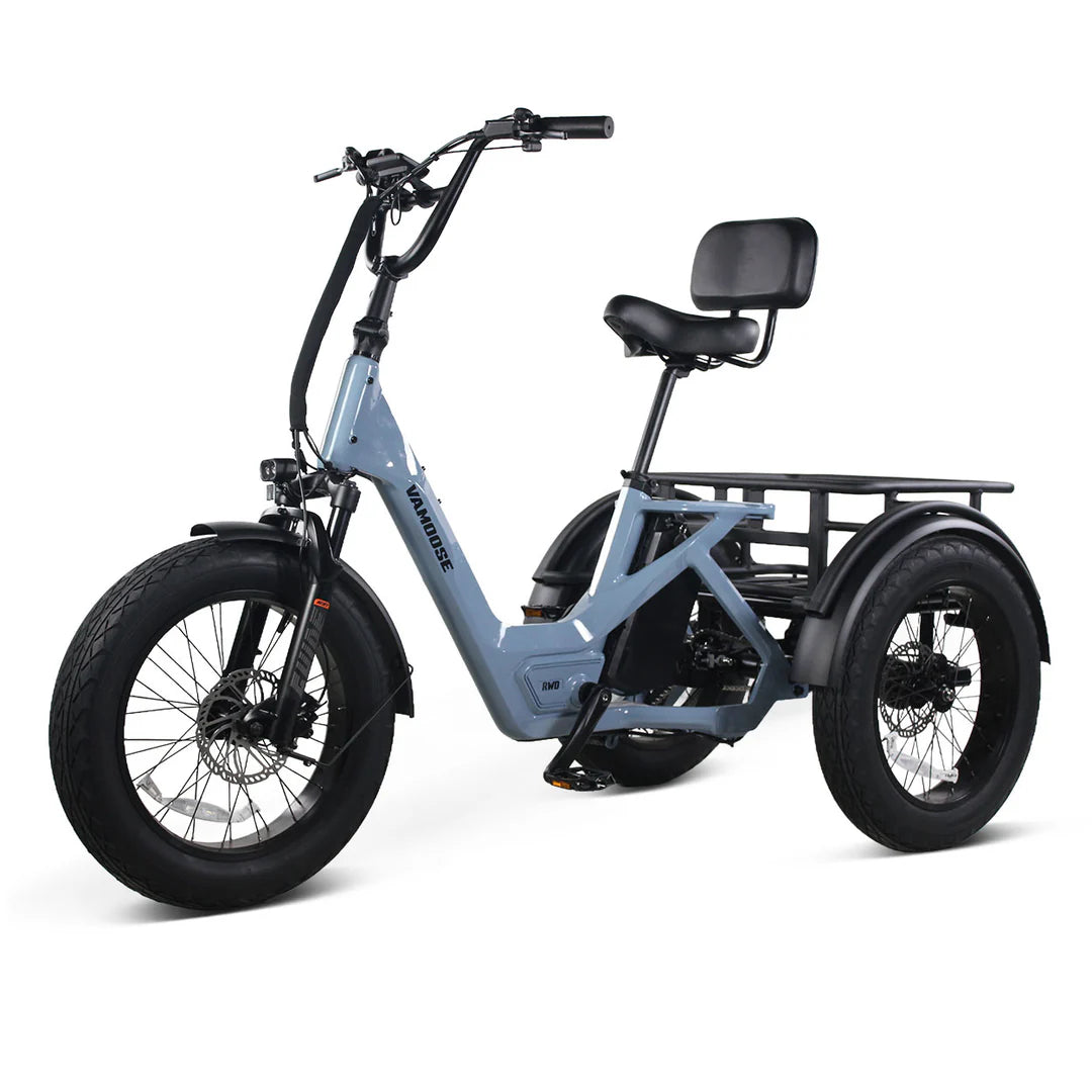 Vamoose Tri-Cycle SST electric trike with 52V 750W rear hub motor and rear differential for stability. Features 20"x4" fat tires, hydraulic disc brakes, comfortable plush seat, folding handlebar stem, and a large 52V 20Ah Samsung battery for extended range. Includes rear carrier bag, front shovel rack, and LED lights with signal indicator.