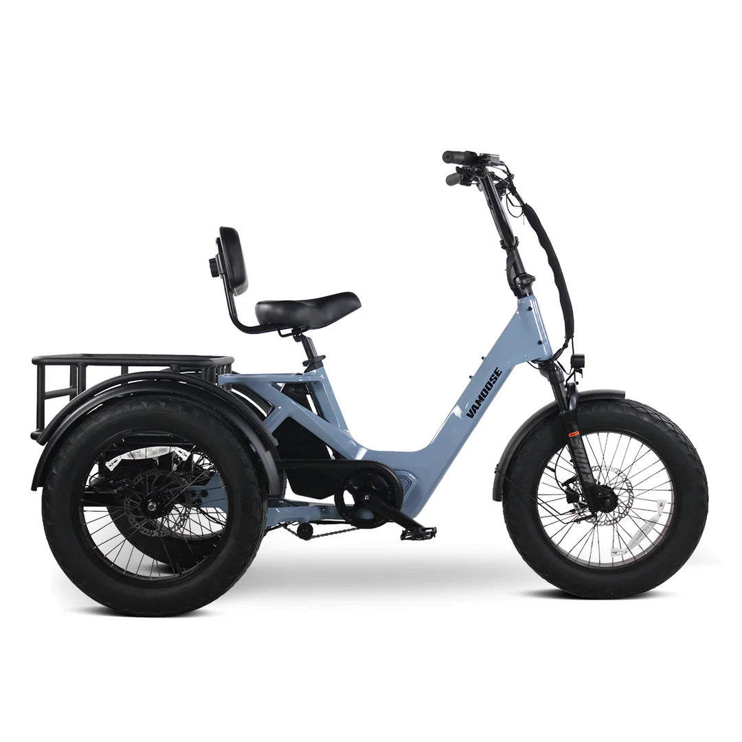 Vamoose Tri-Cycle SST electric trike with 52V 750W rear hub motor and rear differential for stability. Features 20"x4" fat tires, hydraulic disc brakes, comfortable plush seat, folding handlebar stem, and a large 52V 20Ah Samsung battery for extended range. Includes rear carrier bag, front shovel rack, and LED lights with signal indicator.