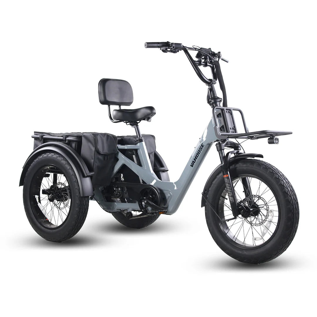 Vamoose Tri-Cycle SST electric trike with 52V 750W rear hub motor and rear differential for stability. Features 20"x4" fat tires, hydraulic disc brakes, comfortable plush seat, folding handlebar stem, and a large 52V 20Ah Samsung battery for extended range. Includes rear carrier bag, front shovel rack, and LED lights with signal indicator.
