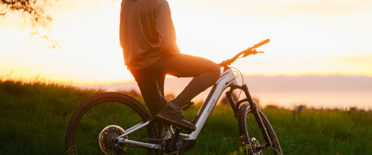 Rider on an Aventon Current EXP at sunset
